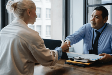 Manager shaking hands with applicant